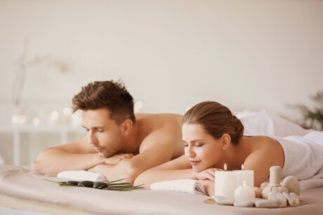 Therapist providing a relaxing back massage in a clean clinic room
