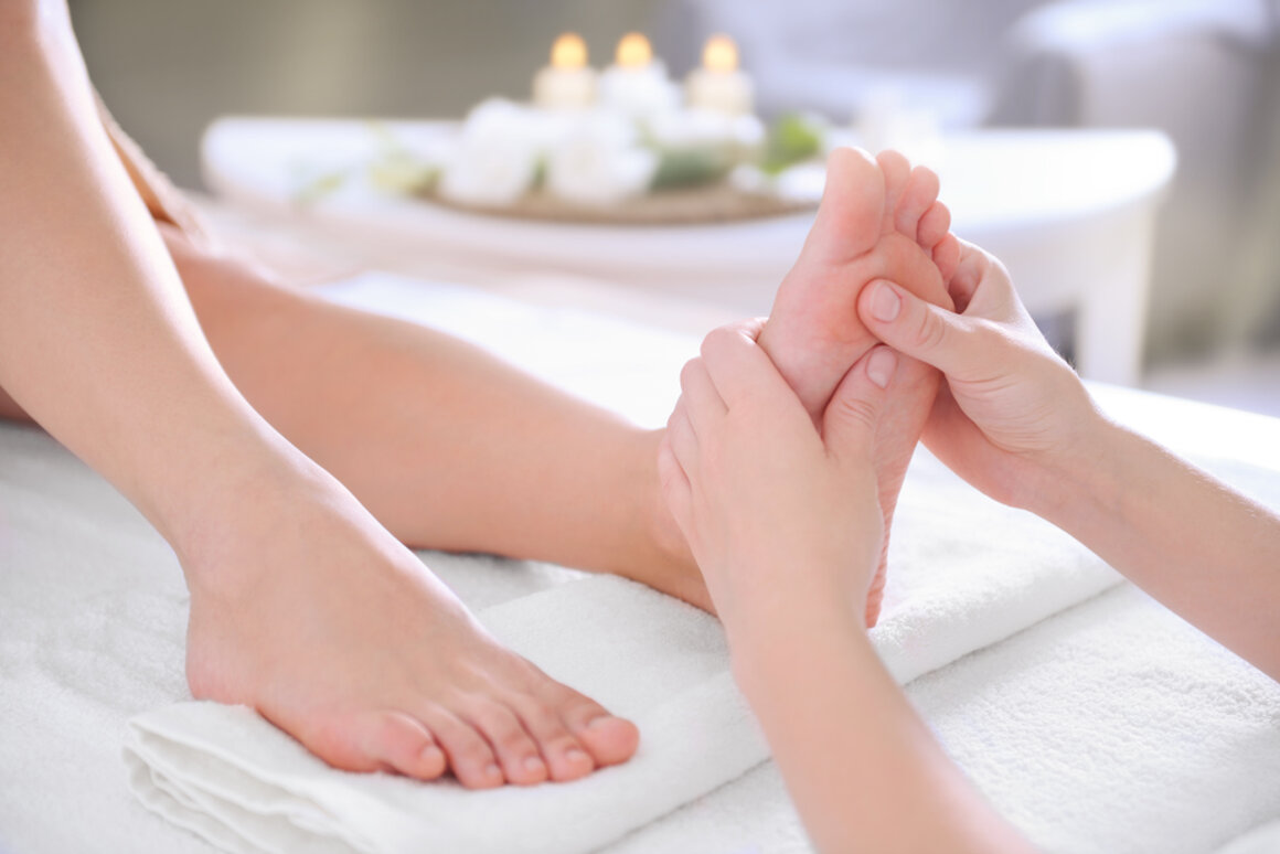 Foot massage treatment with warm lighting