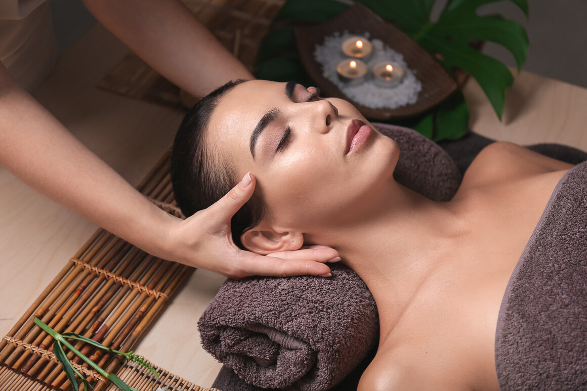 Close-up of neck and shoulder massage in a calm treatment room