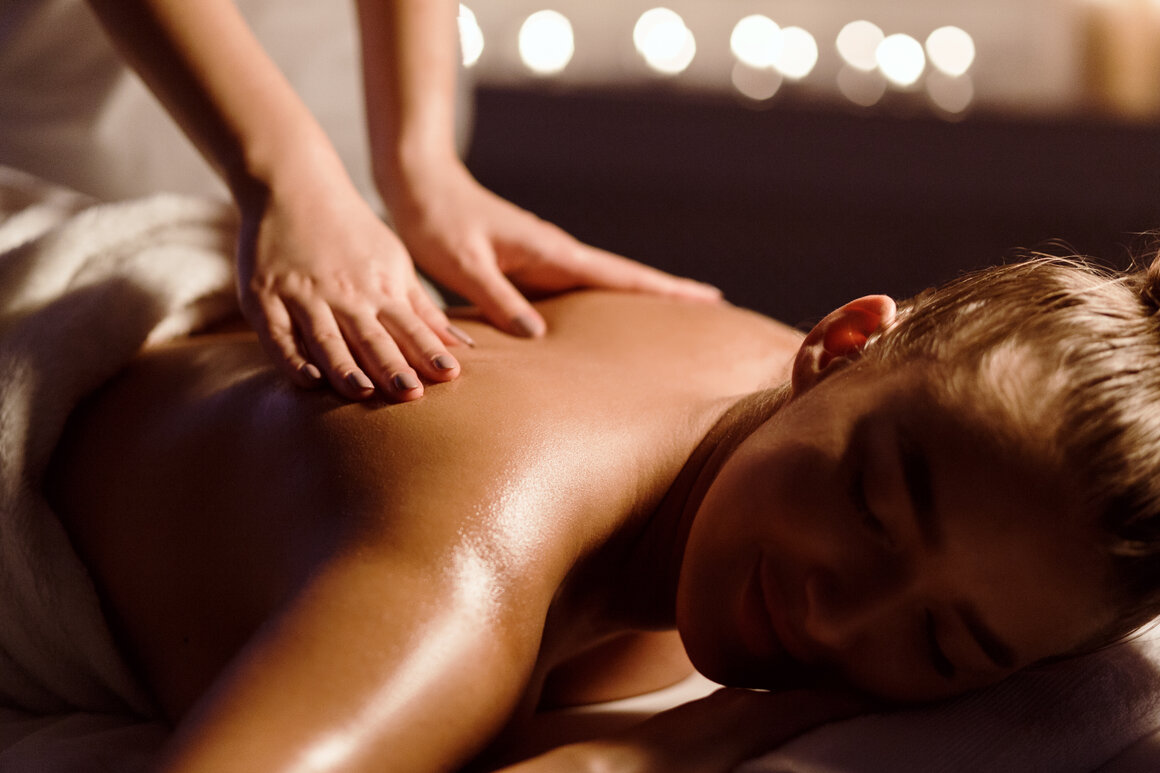 Relaxing full body oil massage on a treatment couch